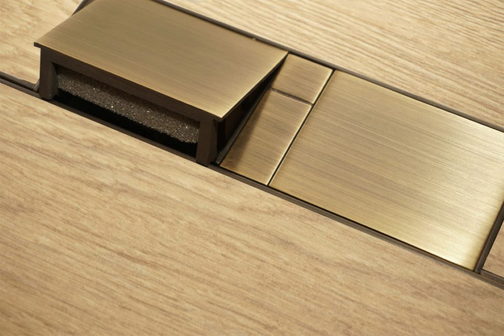 minima antique brass floor box, one flap open one closed