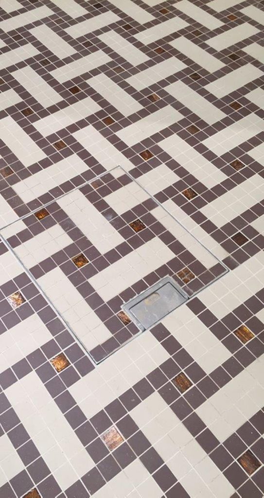 discreet floor box tailored for mosaic-style flooring