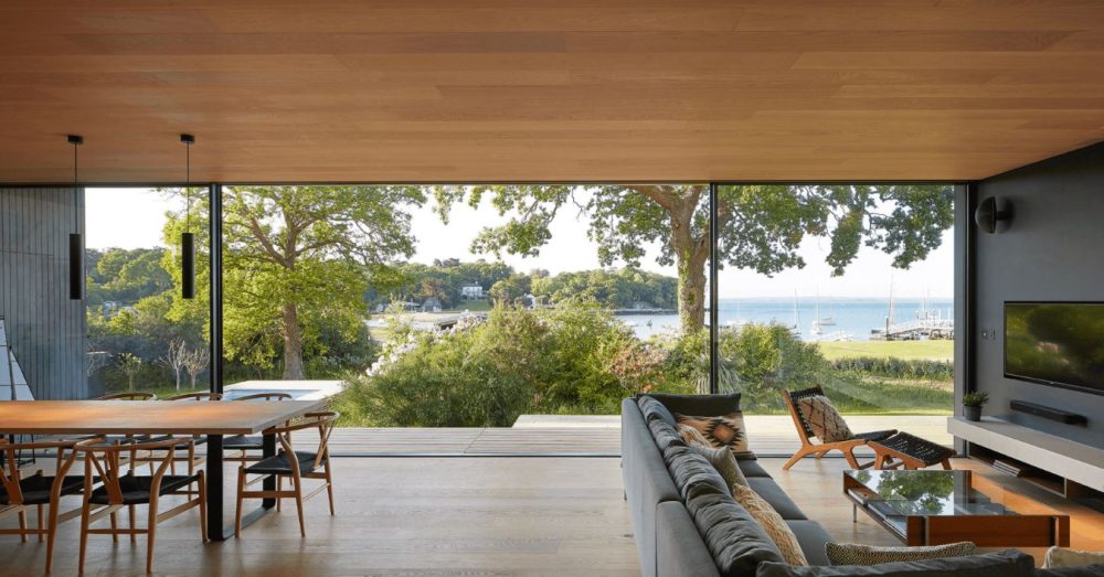 floorbox installation in property with large glass pane doors overlooking sea