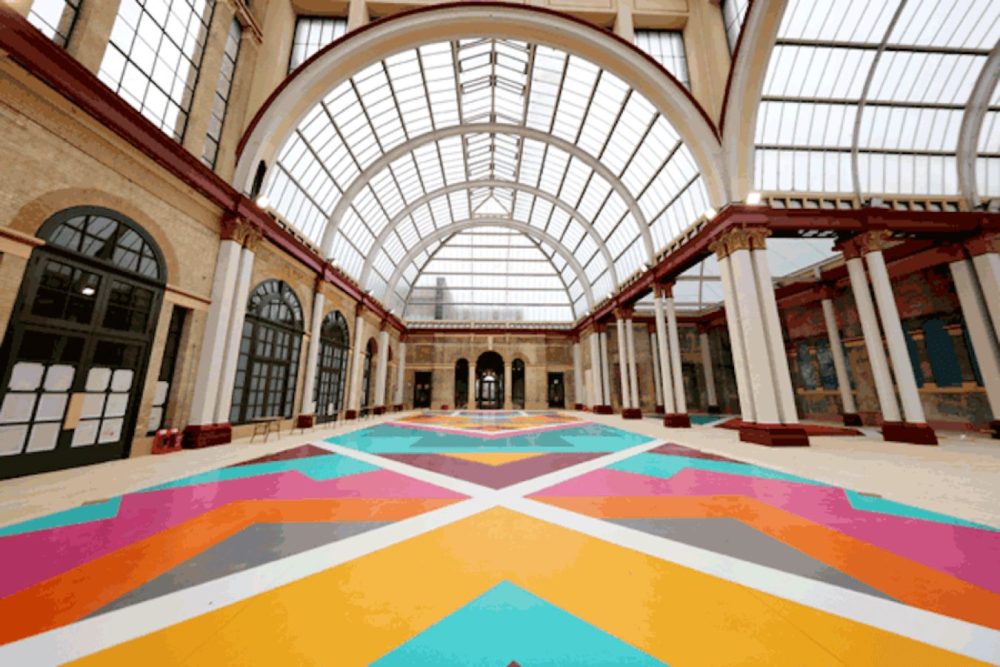 inside Alexandra Palace with multicoloured flooring