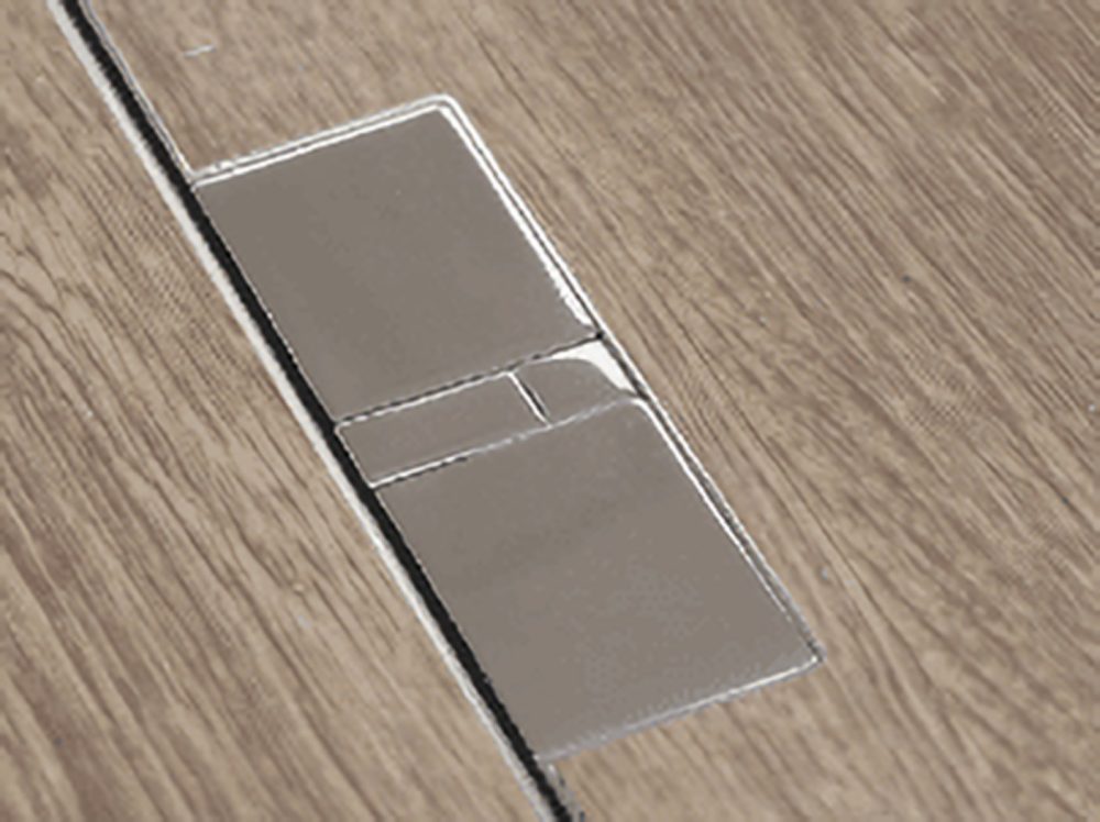 close up of mirror polished steel floor box from cableduct