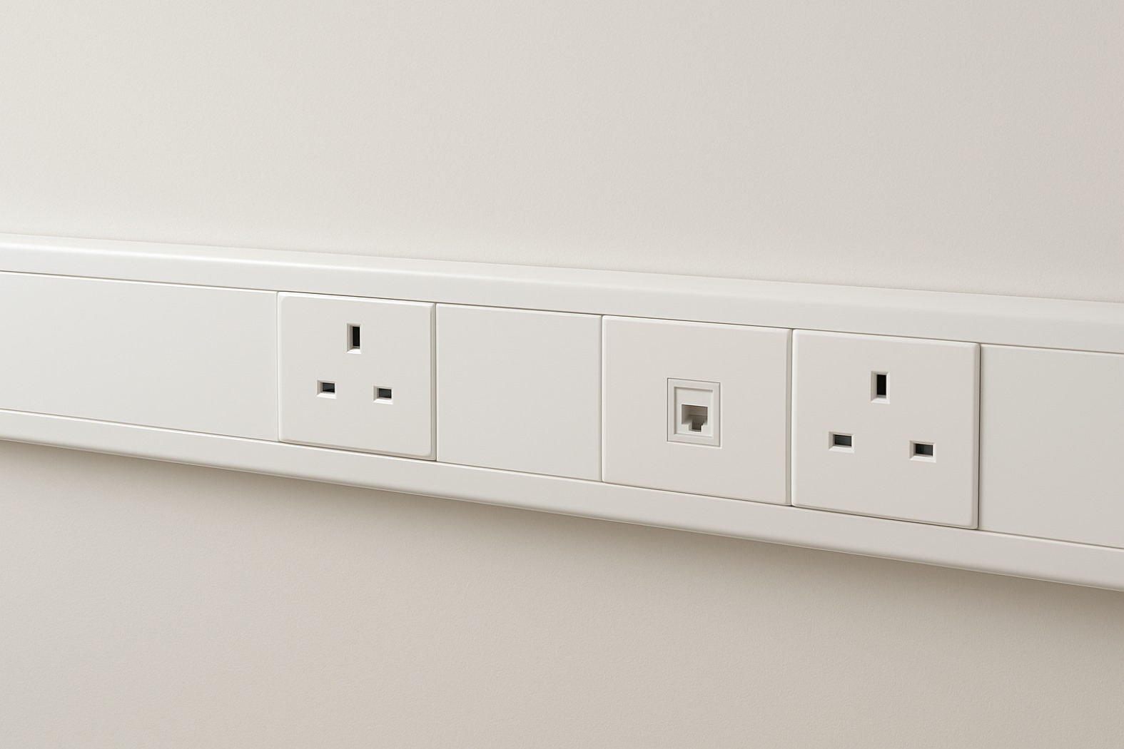 placeholder image of dado trunking with dual sockets in office