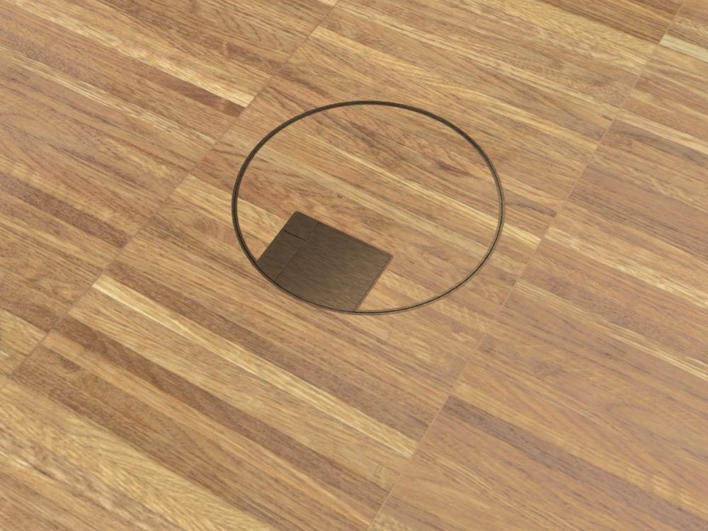 close-up of round Antique Brass hardwood floor box