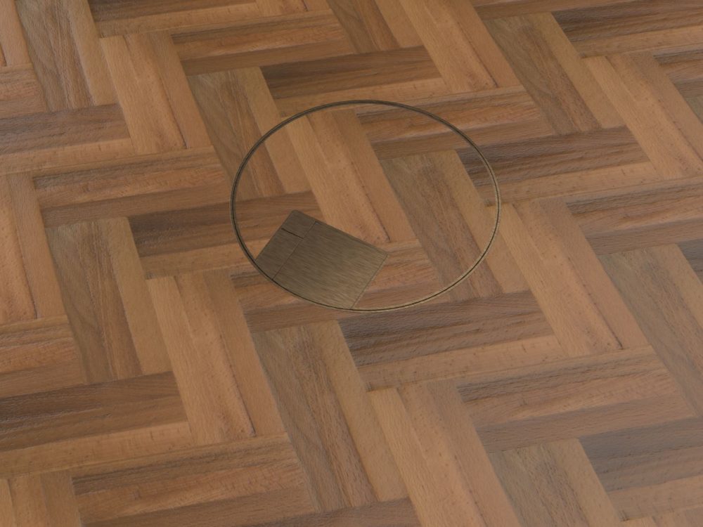 close-up of antique brass round timber floor box
